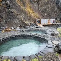 The Husafell Canyon Baths pools and wooden changing facilities